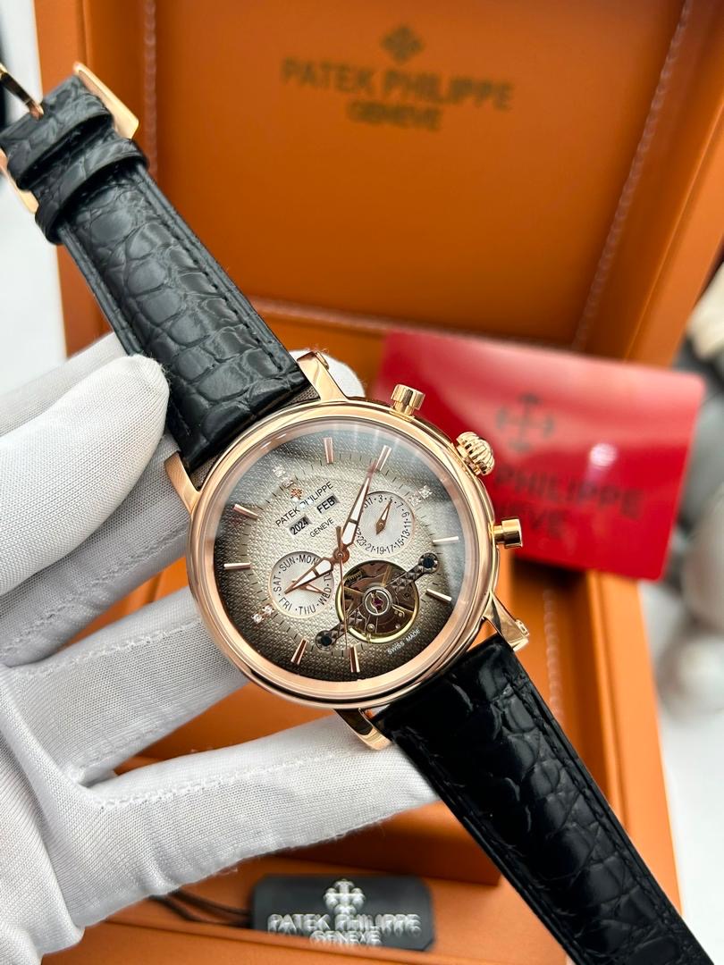 Rose gold luxury wristwatch with black leather strap